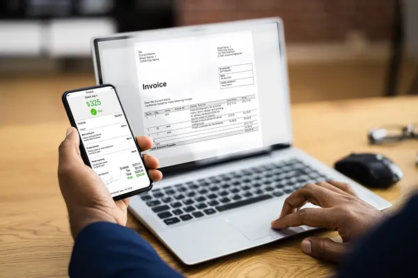 A digital invoice on a computer screen representing a request for payment for services rendered.